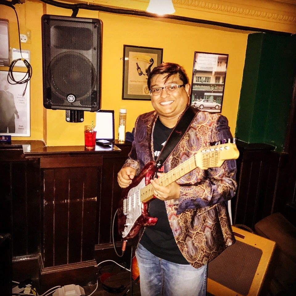 Sean performing live with his guitar