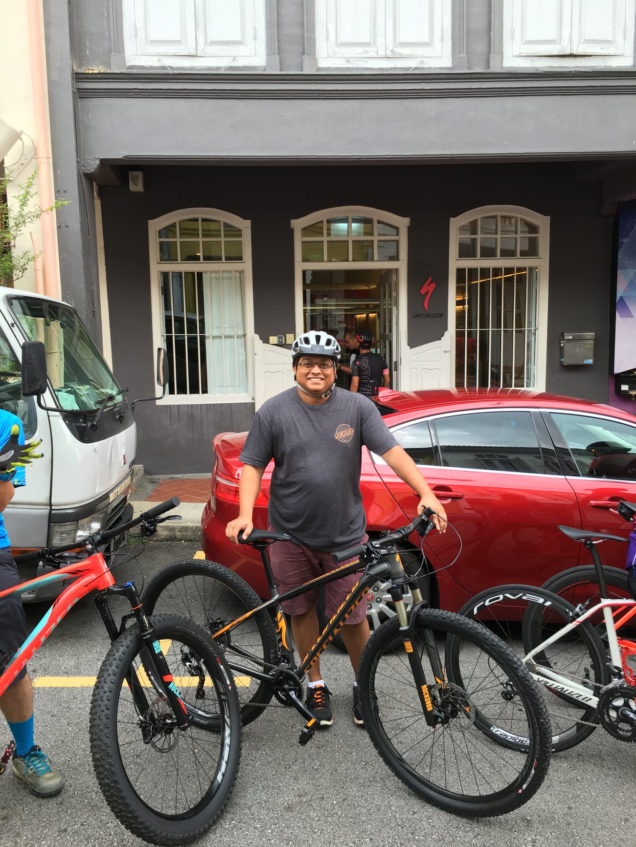 Sean with a mountain bike outside a Specialized concept store